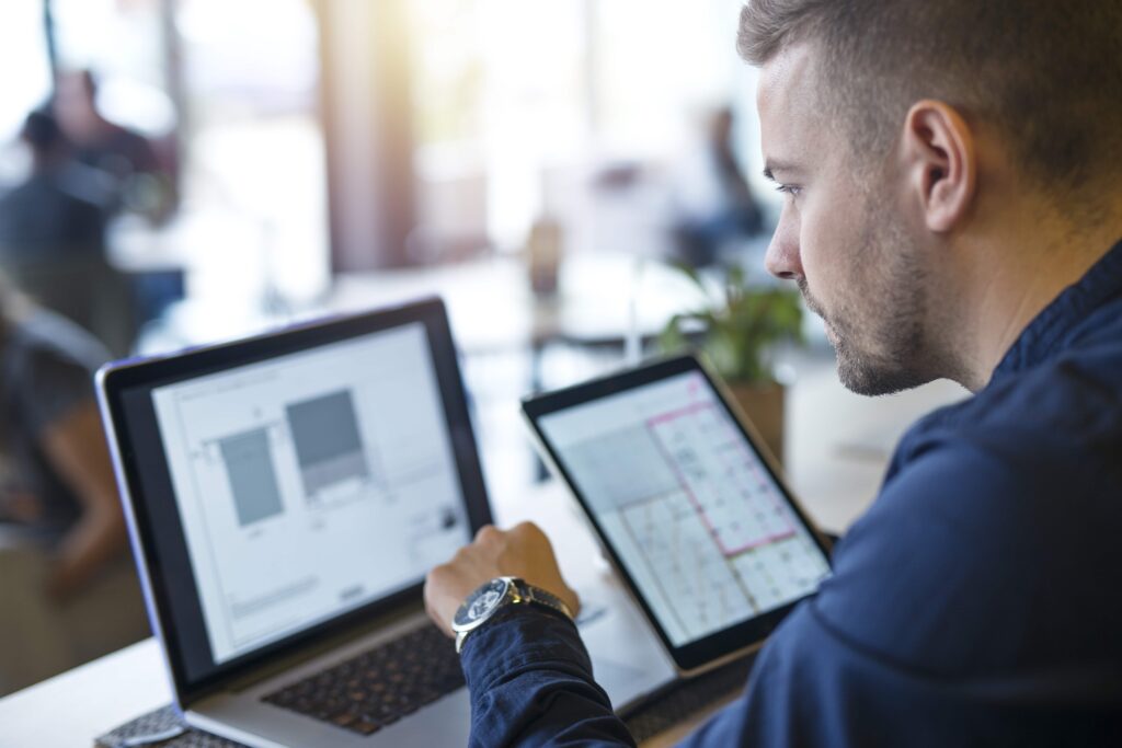 Business Man Looking Analyzing Projects His Laptop Computer Tablet Min